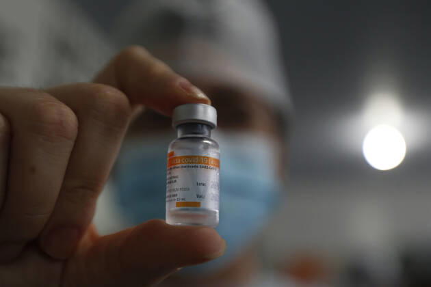 (210120) -- AMAZONAS, Jan. 20, 2021 -- The vaccine developed by Chinese laboratory Sinovac in collaboration with the Butantan Institute of Sao Paulo is displayed in the city of Tabatinga in the state of Amazonas, Brazil, Jan. 19, 2021. Brazil launched a mass immunization campaign against the COVID-19 pandemic in every state starting at 5:00 p.m. Monday local time (2000 GMT). As of Monday afternoon, all states were expected to have received their doses of the CoronaVac vaccine developed by Chinese laboratory Sinovac in collaboration with the Butantan Institute of Sao Paulo, one of the world s leading scientific research centers. (Photo by Xinhua) BRAZIL-AMAZONAS-COVID-19-VACCINE-MASS INOCULATION LucioxTavora 