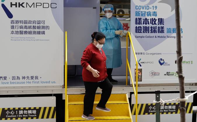 January 20, 2021, Hong Kong, CHINA: Nepali woman stepping down the stair from Mobile Covid-19 Rapid Testing vehicle after completed sample collection. There has been an explosion of Covid infections consecutively among ethnic communities, typically Indian,Pakistani and Nepalis.Jan-20,2021Hong Kong.ZUMA Hong Kong CHINA - ZUMAl137 20210120_zap_l137_010 Copyright: xLiauxChung-renx