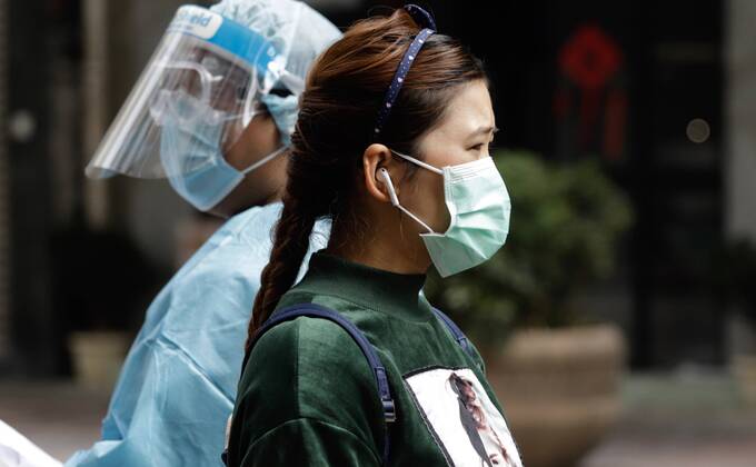 January 20, 2021, Hong Kong, CHINA: Nepali woman standing in front of medical staff queuing for Covid-19 sampling and collection on the sealed street in the designated zone.Jan-20,2021Hong Kong.ZUMA Hong Kong CHINA - ZUMAl137 20210120_zap_l137_014 Copyright: xLiauxChung-renx