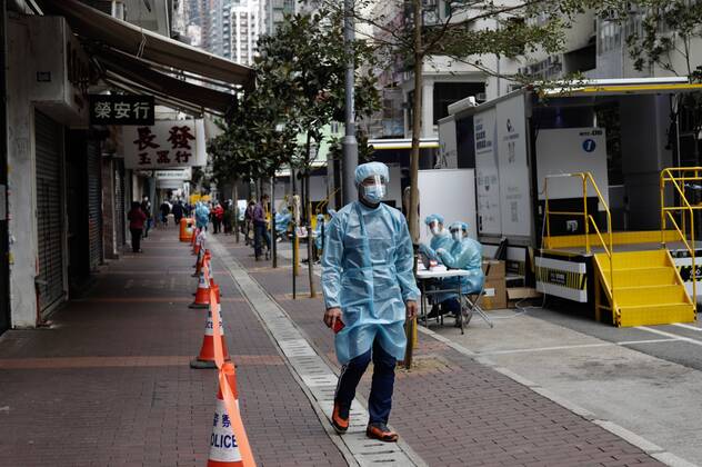 January 20, 2021, Hong Kong, CHINA: Medical staff in full protective gear walk through a sealed street in the designated zone where cluster explosion was identified among ethnic community.Jan-20,2021Hong Kong.ZUMA Hong Kong CHINA - ZUMAl137 20210120_zap_l137_023 Copyright: xLiauxChung-renx