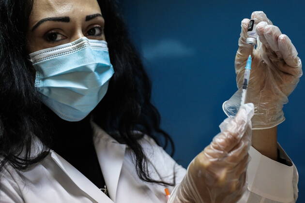 January 20, 2021, Athens, Greece: An elderly woman over 85 years old prepares to receive a shot of the first dose of the Pfizer-BioNTech vaccine against the coronavirus disease (COVID-19), in a vaccine center in Athens. Athens Greece - ZUMAe114 20210120_zaa_e114_001 Copyright: xEurokinissix