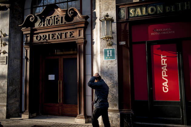 January 21, 2021, Barcelona, Spain: A man walks past a closed hotel in La rambla of Barcelona. The coronavirus pandemic has sunk hotel investment in Barcelona in 2020 by 41 percent compared to the previous year, last year the sector suffered a 95 percent drop in billing and customers in hotels. Recently, the Catalan regional government has once again reduced the capacity of establishments, has limited the opening of bars and restaurants and has tightened the requirements for social gatherings or curfew hours, which makes it impossible for visitors to arrive in Barcelona. Over the last few weeks, more than 50 hotels in the city have closed. Barcelona Spain - ZUMAb137 20210121_zap_b137_016 Copyright: xJordixBoixareux
