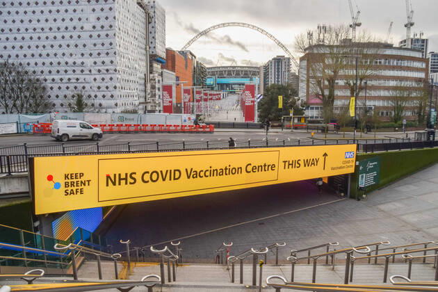 January 21, 2021, London, United Kingdom: A large sign for the NHS covid-19 Vaccination Centre outside Wembley Park station in London..Several mass vaccination sites have been opened around England, as the government rolls out its coronavirus vaccination program. London United Kingdom - ZUMAs197 20210121_zaa_s197_057 Copyright: xVukxValcicx