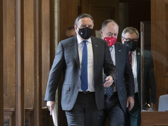 January 21, 2021, Quebec, PQ, Canada: Quebec Premier Francois Legault followed by Quebec Health Minister Christian Dube and Horacio Arruda, Quebec director of National Public Health, walk to a news conference on the COVID-19 pandemic, Thursday, January 21, 2021 at the legislature in Quebec City. Quebec Canada  - ZUMAc35_ 20210121_zaf_c35_033 Copyright: xJacquesxBoissinotx