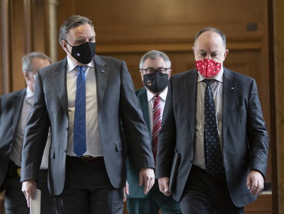 January 21, 2021, Quebec, PQ, Canada: Quebec Premier Francois Legault, left, Quebec Health Minister Christian Dube, right and Horacio Arruda, Quebec director of National Public Health, behind, walk to a news conference on the COVID-19 pandemic, Thursday, January 21, 2021 at the legislature in Quebec City. Quebec Canada - ZUMAc35_ 20210121_zaf_c35_034 Copyright: xJacquesxBoissinotx