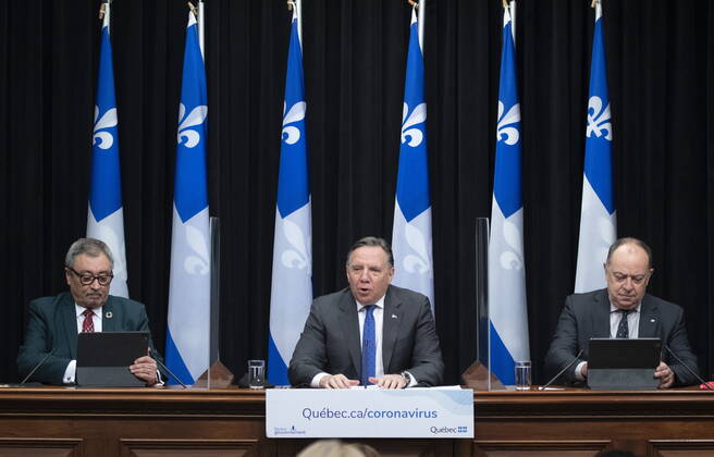 January 21, 2021, Quebec, PQ, Canada: Quebec Premier Francois Legault, flanked by Quebec Health Minister Christian Dube, right, and Horacio Arruda, Quebec director of National Public Health, speaks at a news conference on the COVID-19 pandemic, Thursday, January 21, 2021 at the legislature in Quebec City. Quebec Canada - ZUMAc35_ 20210121_zaf_c35_035 Copyright: xJacquesxBoissinotx