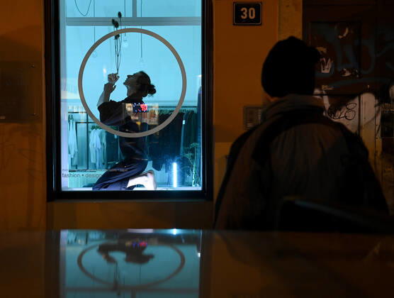 Actors, acrobats and musicians connected with the Cirk La Putyka ensemble performed as part of the Revived Shop windows event in the shop windows of selected closed companies in the center of Prague, Czech Republic, January 21, 2021. (CTKxPhoto OndrejxDeml) CTKPhotoP202101210983401  dml 005