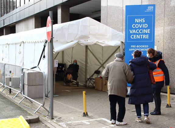January 21, 2021, London, United Kingdom: A medical steward checks in people into the vaccination centre..A steady stream of elderly people with pre-booked appointments at the new Covid-19 Vaccination hub at the Olympic Office Centre, near London s Wembley Stadium. .It is one of 10 new large scale Vaccination centres opened this week, to join the seven already in use across the country. So far 4.9 million people across the UK have received the first dose of vaccine and the government aims for that number to rise to 15 million by 15 February. London United Kingdom - ZUMAs197 20210121_zaa_s197_154 Copyright: xKeithxMayhewx