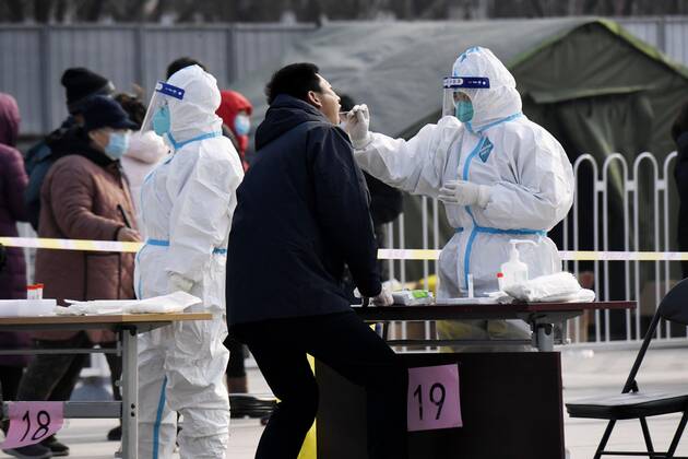 PCR tests in Beijing A person (2nd from R) takes a PCR test in Beijing s Xicheng district on Jan. 22, 2021, amid renewed concerns over the spread of the novel coronavirus. 