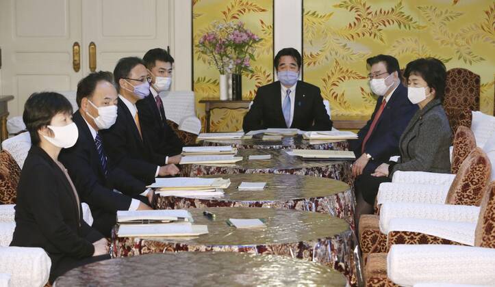 Japan s fight against coronavirus Representatives from the Japanese government and ruling and opposition parties hold talks at the parliament building in Tokyo on Jan. 22, 2021, on revising laws to better deal with the coronavirus crisis. 