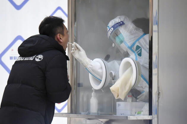 PCR tests in Beijing A local resident takes a PCR test in Beijing s Xicheng district on Jan. 22, 2021, amid renewed concerns over the spread of the novel coronavirus. 