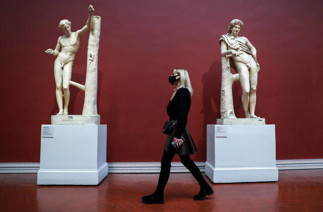 MOSCOW, RUSSIA - JANUARY 22, 2021: A visitor walks past Classical statues at the Pushkin State Museum of Fine Arts. Starting from 22 January 2021, Moscow-based state museums of the federal level are reopening for in-person visits with 50% pre-COVID-19 capacity after being closed for two months, as Moscowâ€™s authorities ease coronavirus restrictions. Sergei Savostyanov TASS  TS0F4D3D
