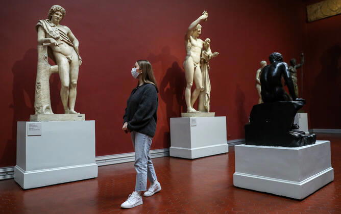 MOSCOW, RUSSIA - JANUARY 22, 2021: A visitor looks at Classical statues at the Pushkin State Museum of Fine Arts. Starting from 22 January 2021, Moscow-based state museums of the federal level are reopening for in-person visits with 50% pre-COVID-19 capacity after being closed for two months, as Moscowâ€™s authorities ease coronavirus restrictions. Sergei Savostyanov TASS  TS0F4D42