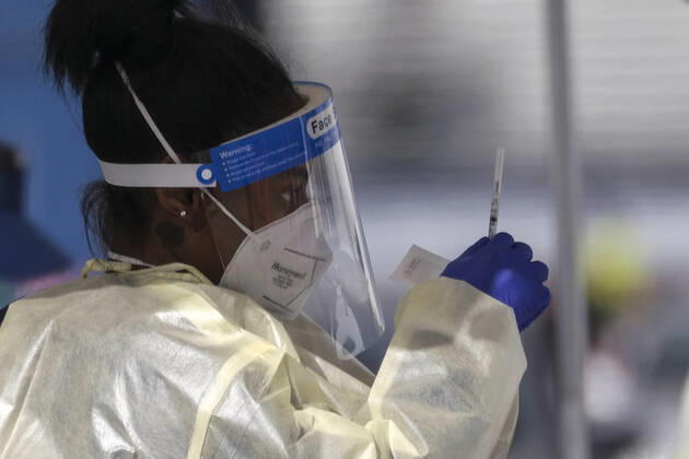 January 22, 2021, Los Angeles, California, USA: A healthcare worker prepares the coronavirus (COVID-19) vaccine for motorists in a parking lot at the Pomona Fairplex, Friday, Jan. 22, 2021, in Pomona, Calif. Los Angeles USA - ZUMAc68_ 20210122_zaf_c68_005 Copyright: xRingoxChiux