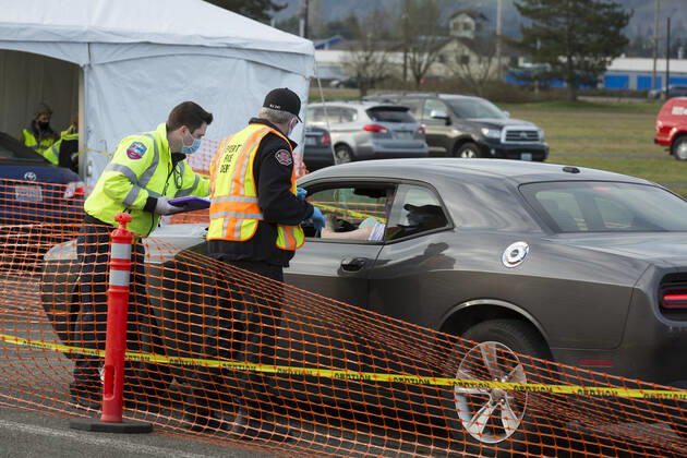 January 22, 2021, Monroe, Washington, USA: A member of the Everett Fire Department gives a shot to a patient at a COVID-19 vaccination site at the Evergreen State Fairgrounds in Monroe, Washington on Friday, January 22, 2021. The site reopened today after closing on Thursday due to a lack of vaccine stock. This week, Washington State moved to Phase 1B tier 1 making vaccines available to anyone 65 and older and all peopleÃ‚ 50 and older who also live in a multigenerational household. Monroe USA - ZUMAg235 20210122_zap_g235_004 Copyright: xPaulxChristianxGordonx