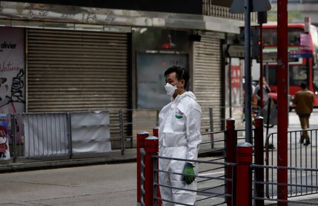 Coronavirus in China, Lockdown in Hongkong January 23, 2021, Hong Kong, CHINA: Staff from Sanitizing Unit stand guard on Temple Street where lockdown has been declared early this morning by HK Government in order to contain spreading of Coronavirus within the designated area.Jan-23,2021Hong Kong.ZUMA Hong Kong CHINA - ZUMAl137 20210123_zap_l137_006 Copyright: xLiauxChung-renx