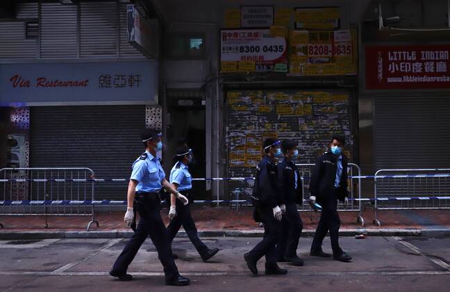 Coronavirus in China, Lockdown in Hongkong January 23, 2021, Hong Kong, CHINA: Policemen patrolling the designated zone in the early morning after Hong Kong Government have announced a LOCKDOWN over Yau Tsim Mong District, where cluster explosion were found and identified. A year after the outbreak of global PANDEMIC originated in Wuhan China, Hong Kong have declared unprecedented measure of lockdown in the designated district in an effort to stop coronavirus from spreading to neighbouring communities on Kowloon Peninsula.Jan-23,2021Hong Kong.ZUMA Hong Kong CHINA - ZUMAl137 20210123_zap_l137_013 Copyright: xLiauxChung-renx