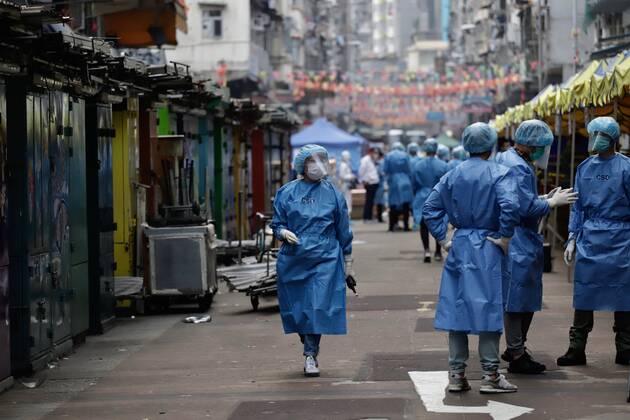 January 23, 2021, Hong Kong, CHINA: Staffs from the Correctional Department gather on the Temple Street inside the restricted zone after lockdown has been announced. Many sectors from Government Disciplined Services are called in to assist the lockdown designated zone.Jan-23,2021Hong Kong.ZUMA Hong Kong CHINA - ZUMAl137 20210123_zap_l137_025 Copyright: xLiauxChung-renx
