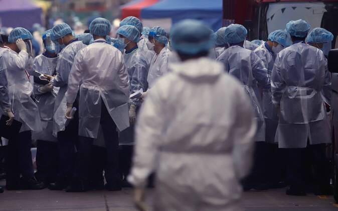 January 23, 2021, Hong Kong, CHINA: Medical Team gather on Temple Street ready to execute duty inside restricted area after LOCKDOWN has been announced by the Government. More than 1,700 public servants were mobilized including police and other disciplined services in order to execute lockdown order in the designated area in Yau Tsim Mong District where continued and multiple coronavirus infections have occurred.Jan-23,2021Hong Kong.ZUMA Hong Kong CHINA - ZUMAl137 20210123_zap_l137_030 Copyright: xLiauxChung-renx