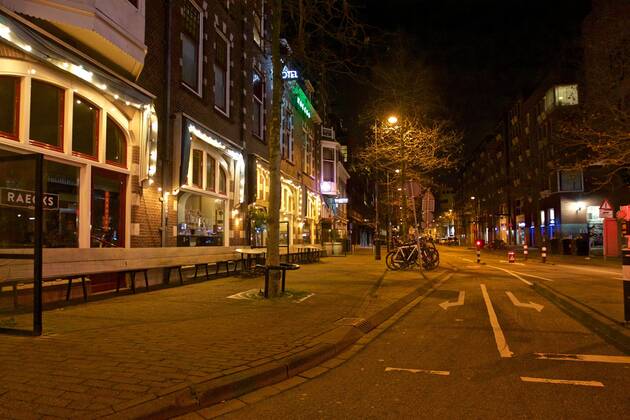 (210124) -- THE HAGUE, Jan. 24, 2021 -- Photo taken on Jan. 23, 2021 shows an empty street in Haarlem, the Netherlands. A curfew to curb the spread of COVID-19 came into force in the Netherlands between 9 pm on Saturday and 4:30 am on Sunday and is scheduled to remain in force every night until Feb. 9. In addition, the Netherlands will suspend all flights from Great Britain, South Africa and South American countries as of Saturday. (Photo by Xinhua) NETHERLANDS-HAARLEM-COVID-19-CURFEW SylviaxLederer 