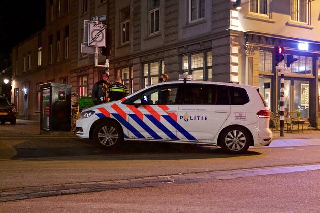 (210124) -- THE HAGUE, Jan. 24, 2021 -- Police officers check a passer-by in Haarlem, the Netherlands, Jan. 23, 2021. A curfew to curb the spread of COVID-19 came into force in the Netherlands between 9 pm on Saturday and 4:30 am on Sunday and is scheduled to remain in force every night until Feb. 9. In addition, the Netherlands will suspend all flights from Great Britain, South Africa and South American countries as of Saturday. (Photo by Xinhua) NETHERLANDS-HAARLEM-COVID-19-CURFEW SylviaxLederer 
