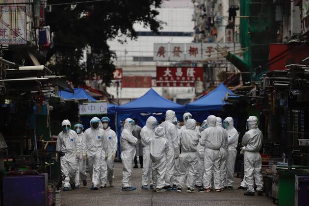 Coronavirus in China, Lockdown in Hongkong January 24, 2021, Hong Kong, CHINA: Government staffs dressed in full protective gear reporting for duty at the empty Yau Ma Tei wet market on the morning of the second day of lockdown.Jan-24,2021Hong Kong.ZUMA Hong Kong CHINA - ZUMAl137 20210124_zap_l137_006 Copyright: xLiauxChung-renx