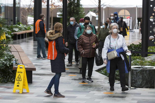 January 24, 2021, Seattle, Washington, USA: A worker directs patients as they arrive at a pop up COVID-19 vaccine clinic at the Amazon Headquarters in Seattle on Sunday, January 24, 2021. Amazon partnered with Virginia Mason Franciscan Health to vaccinate 2,000 Washingtonians who currently qualify to be vaccinated under the stateÃ¢â‚¬â ¢s COVID-19 Vaccine Phases guidelines. Seattle USA - ZUMAg235 20210124_zap_g235_023 Copyright: xPaulxChristianxGordonx