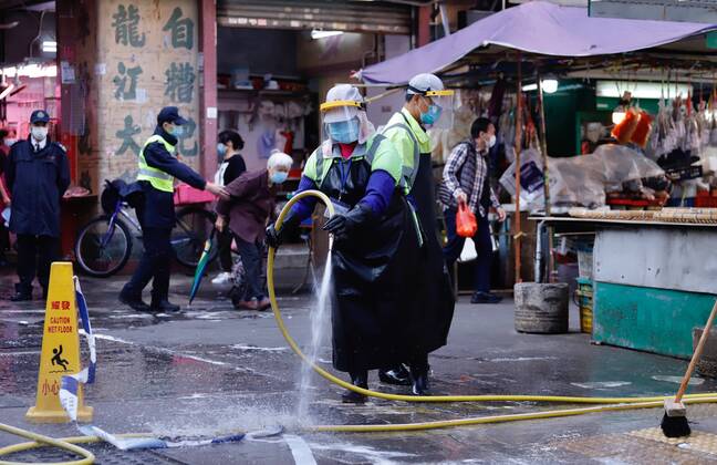 January 25, 2021, Hong Kong, CHINA: Workers sanitizing Yau Ma Tei Wet Market in the restricted zone early this morning after HK Government have lifted partial lockdown in the area which lasted for 48hrs.Jan-25,2021Hong Kong.ZUMA Hong Kong CHINA - ZUMAl137 20210125_zap_l137_005 Copyright: xLiauxChung-renx