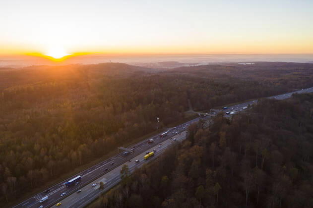 Germany, Baden-Wurttemberg, Stuttgart, Aerial view of traffic on Bundesautobahn 8 at sunset WDF06439