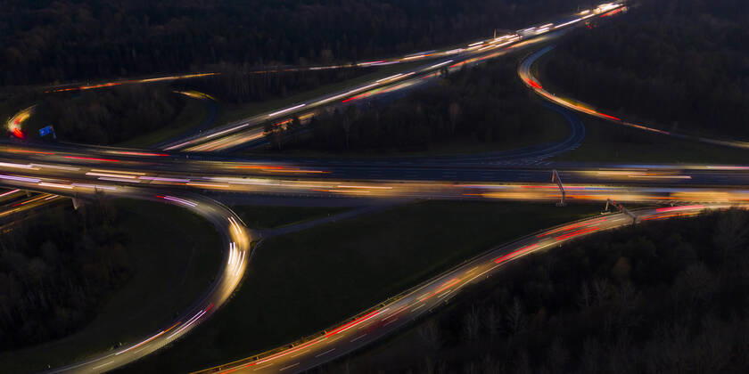 Germany, Baden-Wurttemberg, Stuttgart, Aerial view of vehicle light trails on Bundesautobahn 8 at night WDF06443