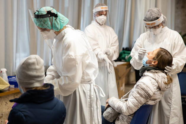 January 25, 2021, Kranj, Slovenia: A doctor wearing a protective suit takes a nasal swab from an elementary school teacher during the rapid COVID-19 antigen test before schools reopen in Kranj..Elementary School teachers take mass rapid COVID-19 antigen testing at the town hall before the return of elementary and kindergarten students to school on Tuesday 26th. Kranj Slovenia - ZUMAs197 20210125_zaa_s197_015 Copyright: xLukaxDakskoblerx