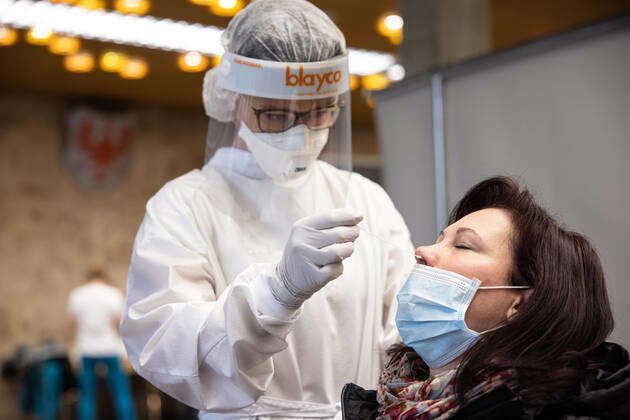 January 25, 2021, Kranj, Slovenia: A doctor wearing a protective suit takes a nasal swab from an elementary school teacher during the rapid COVID-19 antigen test before schools reopen in Kranj..Elementary School teachers take mass rapid COVID-19 antigen testing at the town hall before the return of elementary and kindergarten students to school on Tuesday 26th. Kranj Slovenia - ZUMAs197 20210125_zaa_s197_017 Copyright: xLukaxDakskoblerx