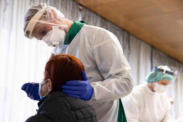 January 25, 2021, Kranj, Slovenia: A doctor wearing a protective suit takes a nasal swab from an elementary school teacher during the rapid COVID-19 antigen test before schools reopen in Kranj..Elementary School teachers take mass rapid COVID-19 antigen testing at the town hall before the return of elementary and kindergarten students to school on Tuesday 26th. Kranj Slovenia - ZUMAs197 20210125_zaa_s197_022 Copyright: xLukaxDakskoblerx