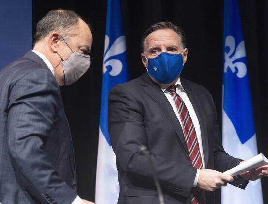 January 26, 2021, Montreal, PQ, Canada: Quebec Premier Francois Legault, right, has a word with Health Minister Christian Dube as the leave the COVID-19 press briefing, Tuesday, January 26, 2021 in Montreal. Montreal Canada  - ZUMAc35_ 20210126_zaf_c35_030 Copyright: xRyanxRemiorzx