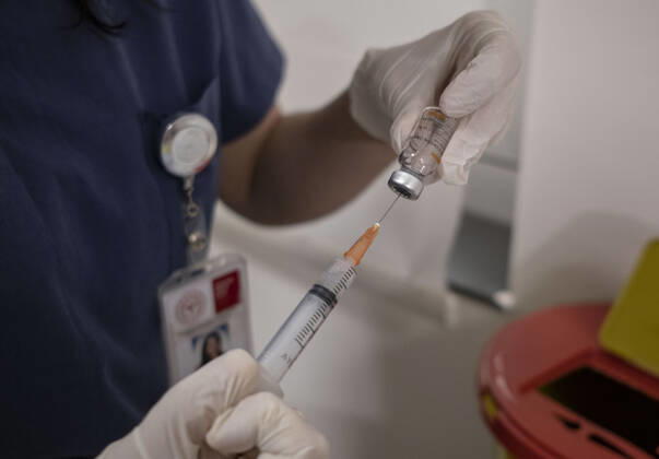(210127) -- ISTANBUL, Jan. 27, 2021 -- A medical worker prepares a dose of COVID-19 vaccine in Istanbul, Turkey, Jan. 27, 2021. A state hospital in Turkey s largest city Istanbul Wednesday was filled with senior citizens who came to be vaccinated against COVID-19 as part of the ongoing mass inoculation program in the country. TO GO WITH Feature: Turkish seniors hope pandemic to end with COVID-19 vaccines (Photo by Xinhua) TURKEY-ISTANBUL-VACCINATION OsmanxOrsal 