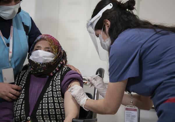 (210127) -- ISTANBUL, Jan. 27, 2021 -- A woman receives a dose of COVID-19 vaccine in Istanbul, Turkey, Jan. 27, 2021. A state hospital in Turkey s largest city Istanbul Wednesday was filled with senior citizens who came to be vaccinated against COVID-19 as part of the ongoing mass inoculation program in the country. TO GO WITH Feature: Turkish seniors hope pandemic to end with COVID-19 vaccines (Photo by Xinhua) TURKEY-ISTANBUL-VACCINATION OsmanxOrsal 