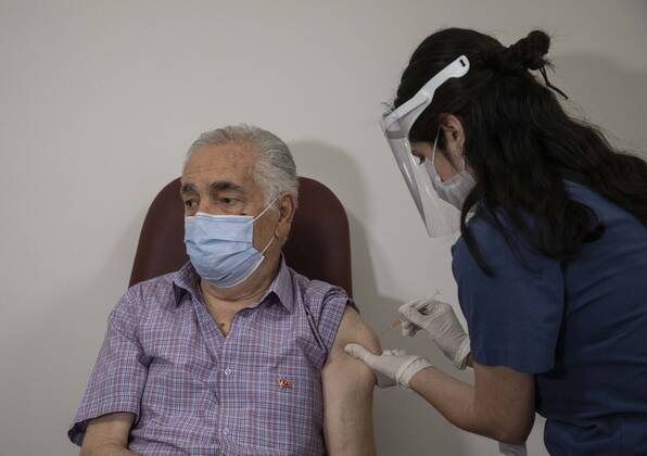 (210127) -- ISTANBUL, Jan. 27, 2021 -- A man receives a dose of COVID-19 vaccine in Istanbul, Turkey, Jan. 27, 2021. A state hospital in Turkey s largest city Istanbul Wednesday was filled with senior citizens who came to be vaccinated against COVID-19 as part of the ongoing mass inoculation program in the country. TO GO WITH Feature: Turkish seniors hope pandemic to end with COVID-19 vaccines (Photo by Xinhua) TURKEY-ISTANBUL-VACCINATION OsmanxOrsal 