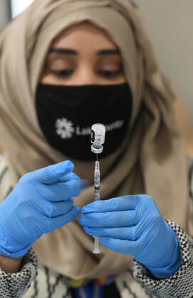 January 27, 2021, Grayslake, Illinois, USA: 600 doses of the Moderna and Pfizer vaccines against COVID-19 were expected to be administered to people in Phase 1a at the Lake County Fairgrounds and Event Center in Grayslake, Illinois Wednesday January 27, 2021. Some people were getting their first vaccine dose, others their second. Officials hope to boost up to 1,000 doses per session next week. Illinois Gov. J.B. Pritzker toured the site and announced that governors have been told to expect increased shipments of vaccines to their states, beginning next week. DR. SANA AHMED prepares doses of the Pfizer vaccine. Grayslake USA - ZUMAh154 20210127_znp_h154_002 Copyright: xMarkxHertzbergx