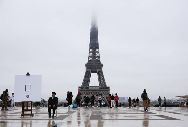 (210127) -- PARIS, Jan. 27, 2021 -- People walk at the Trocadero near the Eiffel Tower in Paris, France, on Jan. 27, 2021. France reported 26,916 COVID-19 infections in the last 24 hours, the country s biggest daily tally this month, health authority s data showed on Wednesday. The country s total cases now stand at 3,106,859, while 74,456 people have died of the respiratory illness, a single-day rise of 350. ) FRANCE-PARIS-COVID-19-CASES GaoxJing