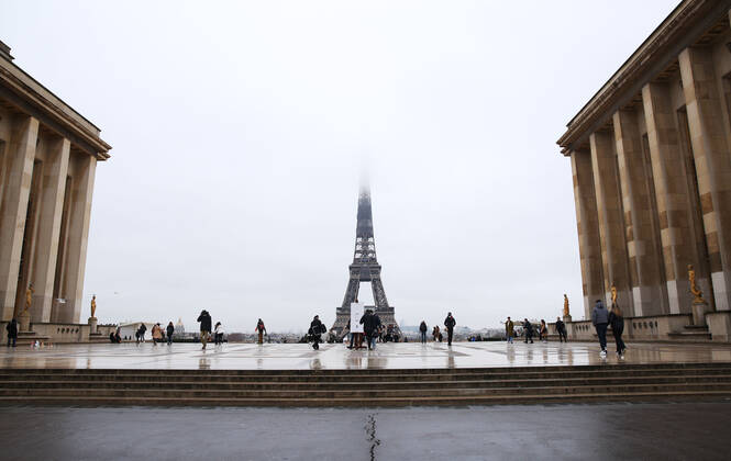 (210127) -- PARIS, Jan. 27, 2021 -- People walk at the Trocadero near the Eiffel Tower in Paris, France, on Jan. 27, 2021. France reported 26,916 COVID-19 infections in the last 24 hours, the country s biggest daily tally this month, health authority s data showed on Wednesday. The country s total cases now stand at 3,106,859, while 74,456 people have died of the respiratory illness, a single-day rise of 350. ) FRANCE-PARIS-COVID-19-CASES GaoxJing