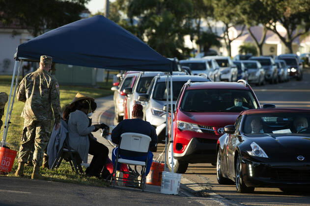 January 28, 2021, Sun City Center, FL, USA: Florida residents 65 years and older queue in the early morning for Covid-19 Vaccine shots at a community center in Hillsborough County on the states Gulf Coast. Community volunteers and National Guard troops helped the operation to run efficiently, residents said. Sun City Center USA - ZUMAn03_ 20210128_zaf_n03_001 Copyright: xRobinxRaynex