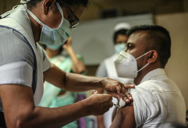January 29, 2021, Colombo, Sri Lanka: A Sri Lankan health worker receives an Oxford-AstraZeneca Covid-19 vaccine dose against the Coronavirus (COVID-19) at The National Hospital Colombo in Sri Lanka on January 29, 2021. Colombo Sri Lanka - ZUMAd152 20210129_znp_d152_007 Copyright: xPradeepxDambaragex