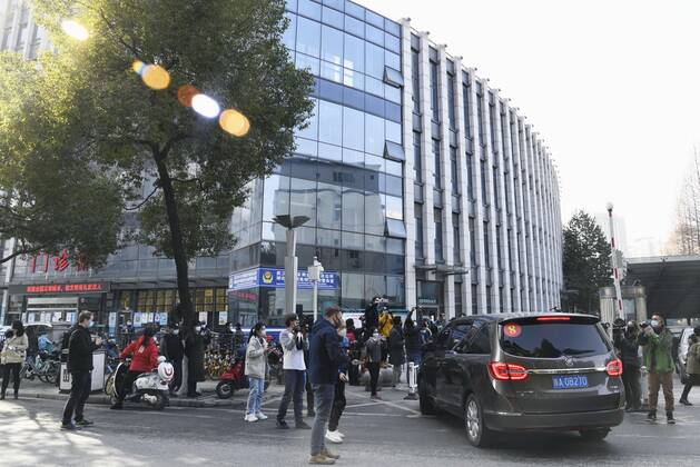 WHO probe into coronavirus origins in Wuhan A car carrying investigative team members of the World Health Organization arrives at a hospital in Wuhan, China, on Jan. 29, 2021. They started the previous day a full-fledged investigation in the central Chinese city of Wuhan, where the novel coronavirus was first detected in late 2019. 