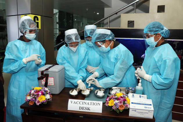 (210129) -- COLOMBO, Jan. 29, 2021 -- Medical workers prepare for the COVID-19 vaccination at the National Infectious Disease Hospital (IDH) in Colombo, Sri Lanka, Jan. 29, 2021. Sri Lanka s health officials on Friday kicked off the country s first COVID-19 vaccination program by inoculating a senior consultant physician at the National Infectious Disease Hospital (IDH) who has been in the front lines of the pandemic, local media reported. Dr. Ananda Wijewickrama was the first medical officer to receive the jab on Friday morning, which was monitored by hospital staff and government officials. A senior nurse at the IDH was the second to receive the jab while three military officers also received the jab at the Army Hospital in Colom 