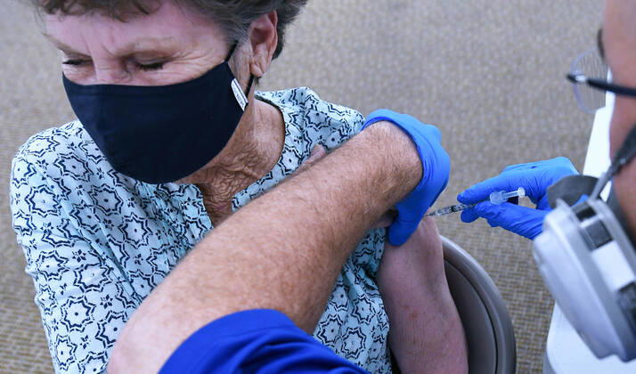 January 29, 2021, Leesburg, Florida, United States: A woman receives a shot of the Pfizer vaccine at a walk-in COVID-19 vaccination POD inside a vacant Sears store at the Lake Square Mall..The appointment-only site for frontline health care workers and seniors 65 and older is vaccinating around 700 people a day. Leesburg United States - ZUMAs197 20210129_zaa_s197_141 Copyright: xPaulxHennessyx
