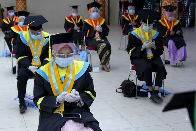 Indonesia: Student Graduation during the Covid-19 pandemic Students pray at the end of the Graduation Ceremony during the pandemic at the State Islamic University of Palembang, South Sumatra, Saturday, January 30, 2021 Palembang South Sumatra Indonesia Copyright: AdamxRachman