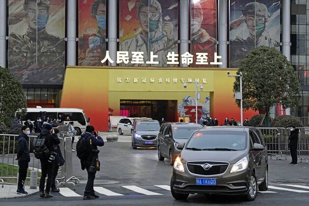 WHO probe into coronavirus origins in Wuhan A motorcade carrying members of the World Health Organization s team investigating the origins of the coronavirus pandemic leaves the venue of an exhibition about China s fight against the virus on Jan. 30, 2021, in Wuhan. 