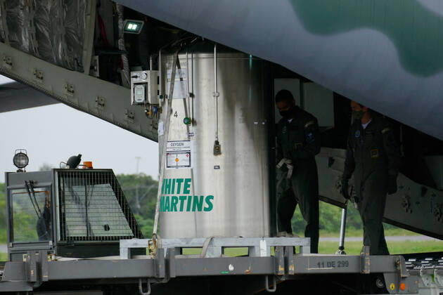 MANAUS, AM - 30.01.2021: CHEGADA DE TANQUES DE OXIGÊNIO EM MANAUS - Arrival by KC-390 plane, of the Brazilian Air Force (FAB) in Manaus (AM), with loading of liquid oxygen tanks, at Ponta Pelada Airport, this Saturday afternoon (30). In the photo, the oxygen tanks being discharged from the FAB plane. x2026446x  SandroxPereira