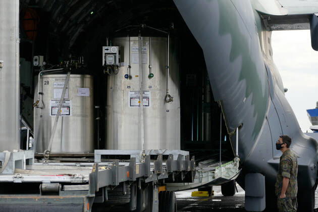 MANAUS, AM - 30.01.2021: CHEGADA DE TANQUES DE OXIGÊNIO EM MANAUS - Arrival by KC-390 plane, of the Brazilian Air Force (FAB) in Manaus (AM), with loading of liquid oxygen tanks, at Ponta Pelada Airport, this Saturday afternoon (30). In the photo, the oxygen tanks being discharged from the FAB plane. x2026449x  SandroxPereira