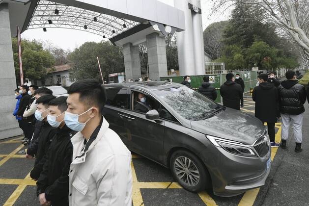 WHO probe into coronavirus origins in Wuhan A vehicle carrying members of the World Health Organization s team investigating the origins of the coronavirus pandemic leaves an infectious disease prevention center in Wuhan, China, on Feb. 1, 2021. 